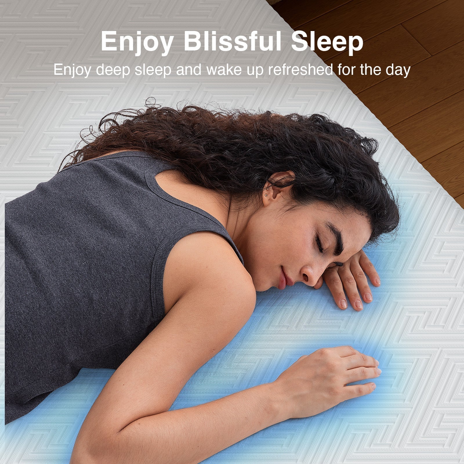 A woman enjoying a blissful sleep on a cooling mattress topper, highlighted with a blue zone for comfort
