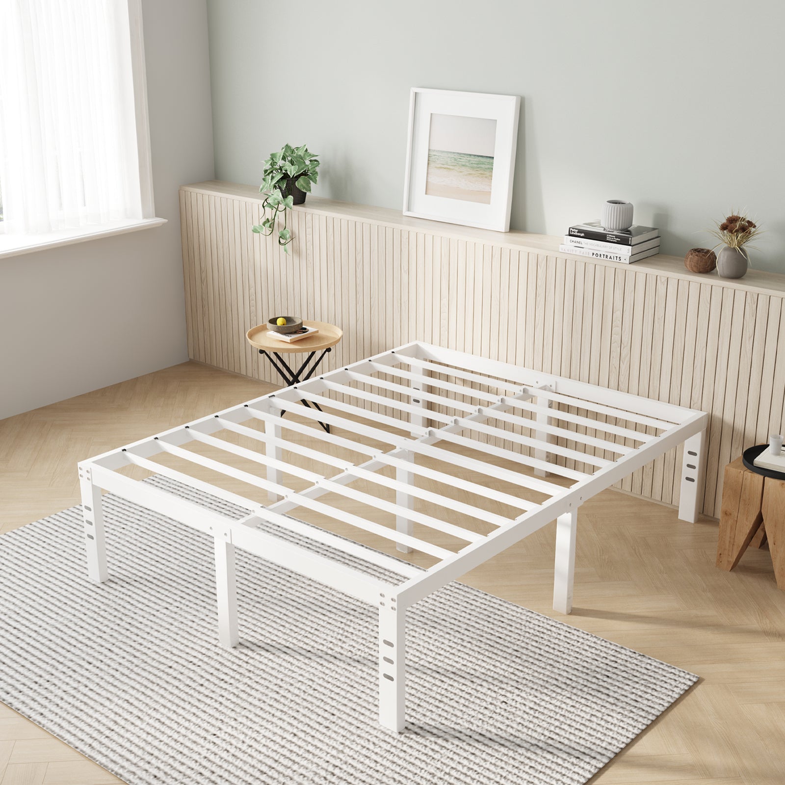 White Vantor metal bed frame with adjustable legs and horizontal slats on striped rug.