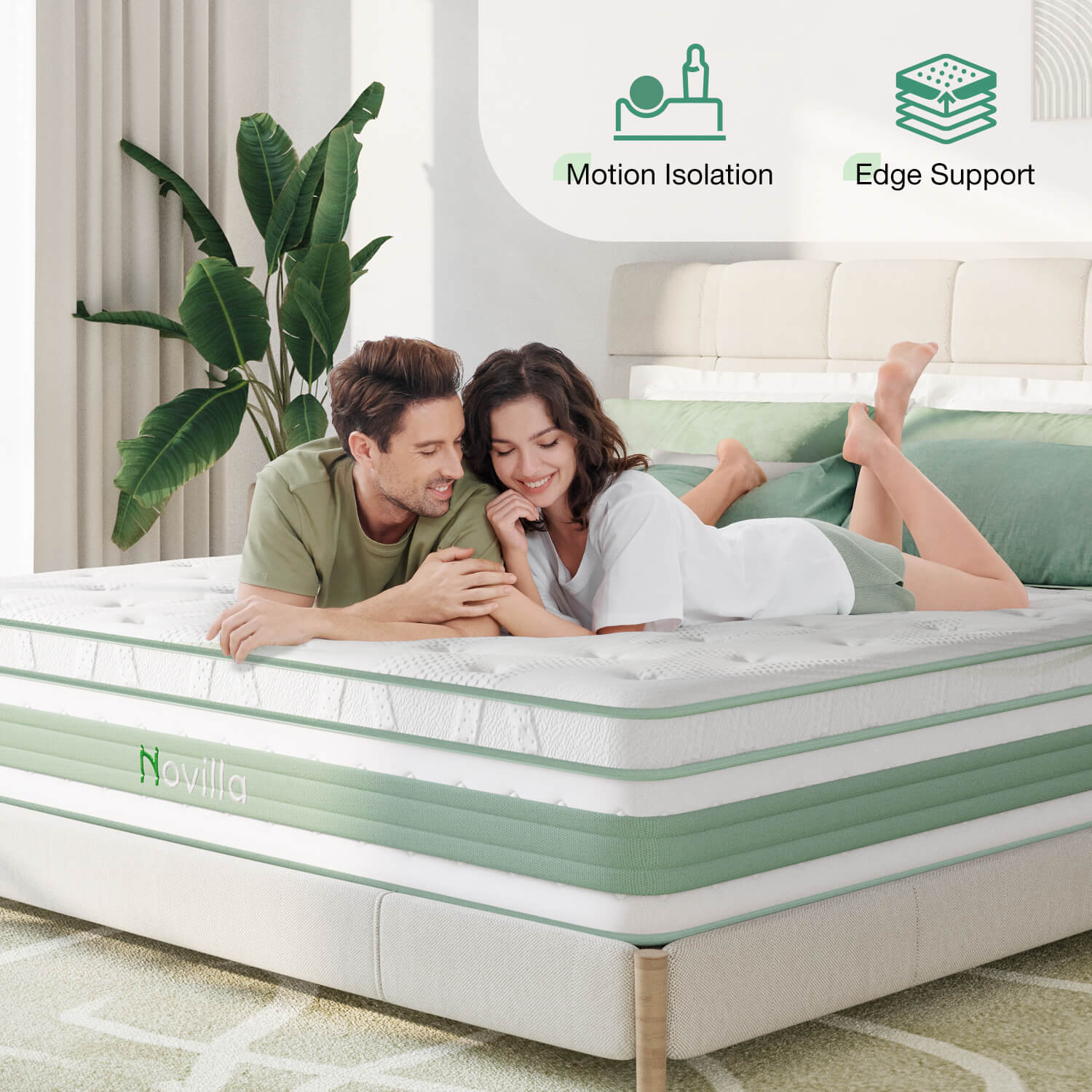 Novilla Buoyant Hybrid Mattress: Couple enjoying motion isolation & edge support on white quilted top mattress.