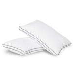 Two white queen size neck support pillows with diamond pattern fabric and gray piping on white background.