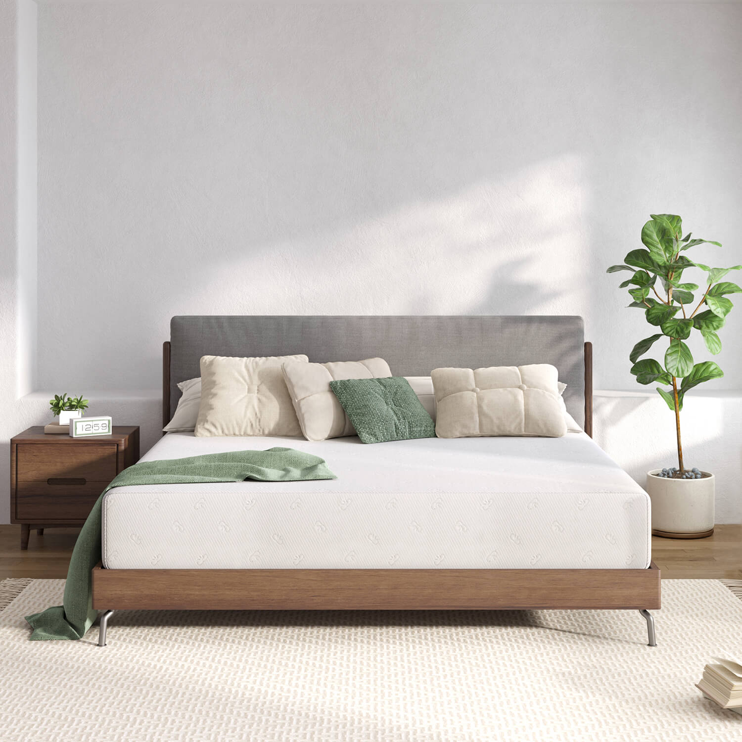 Quietude memory foam mattress with embossed pattern on a wooden bed with cream and green pillows in a bedroom.