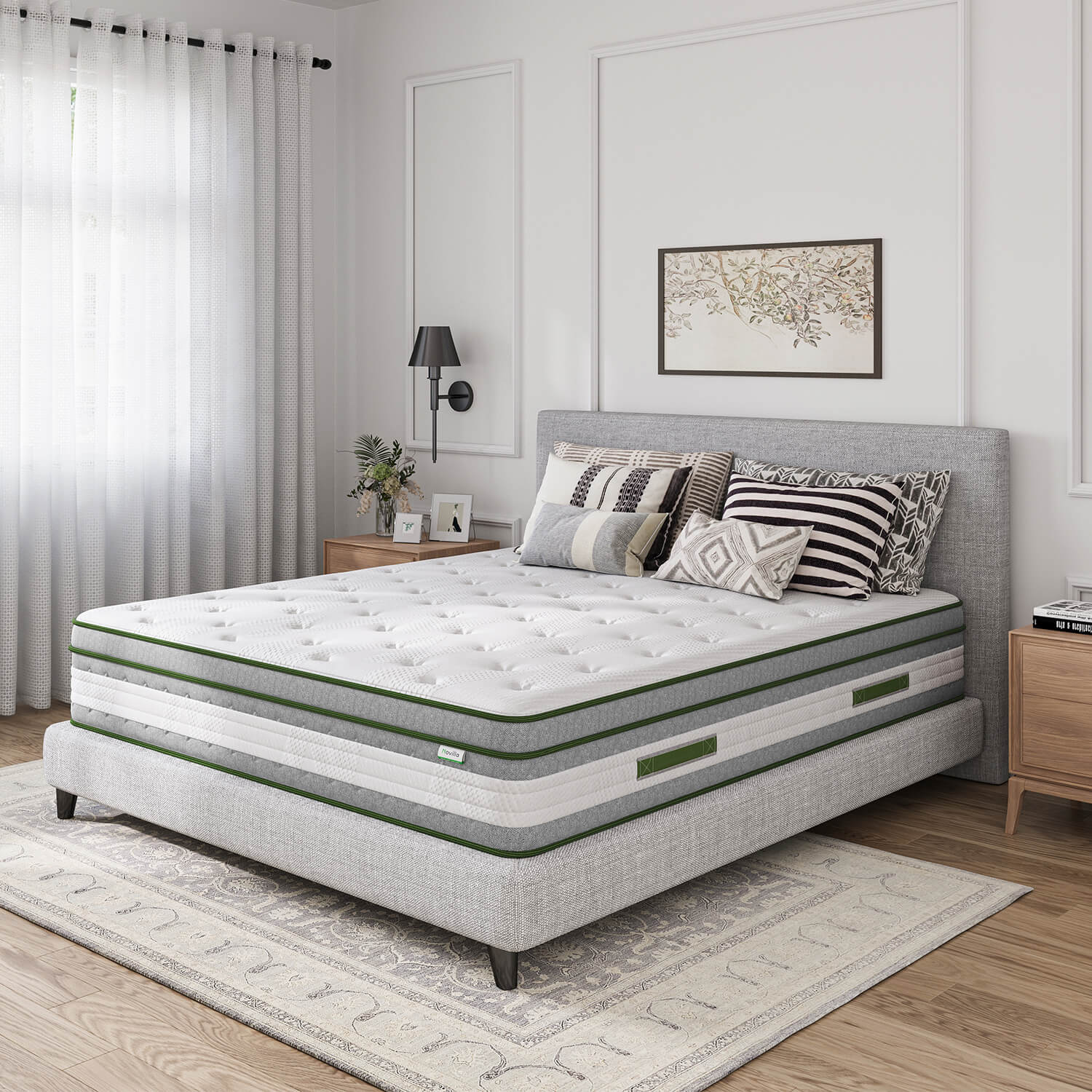 Novilla Vitality 12-inch hybrid mattress with green trim on a grey upholstered bed frame with decorative pillows.