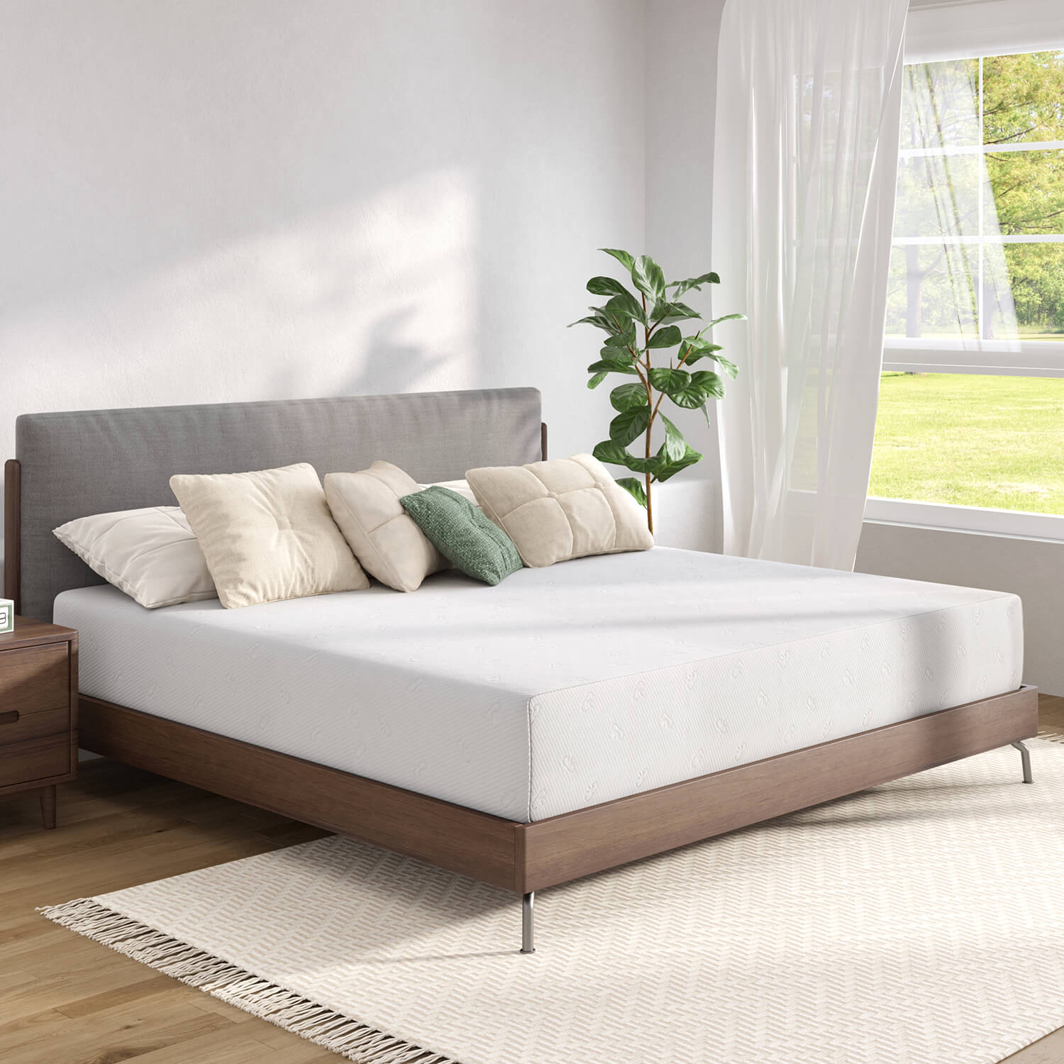 Quietude memory foam mattress on dark wood bed with cream and green pillows, serene bedroom setting.