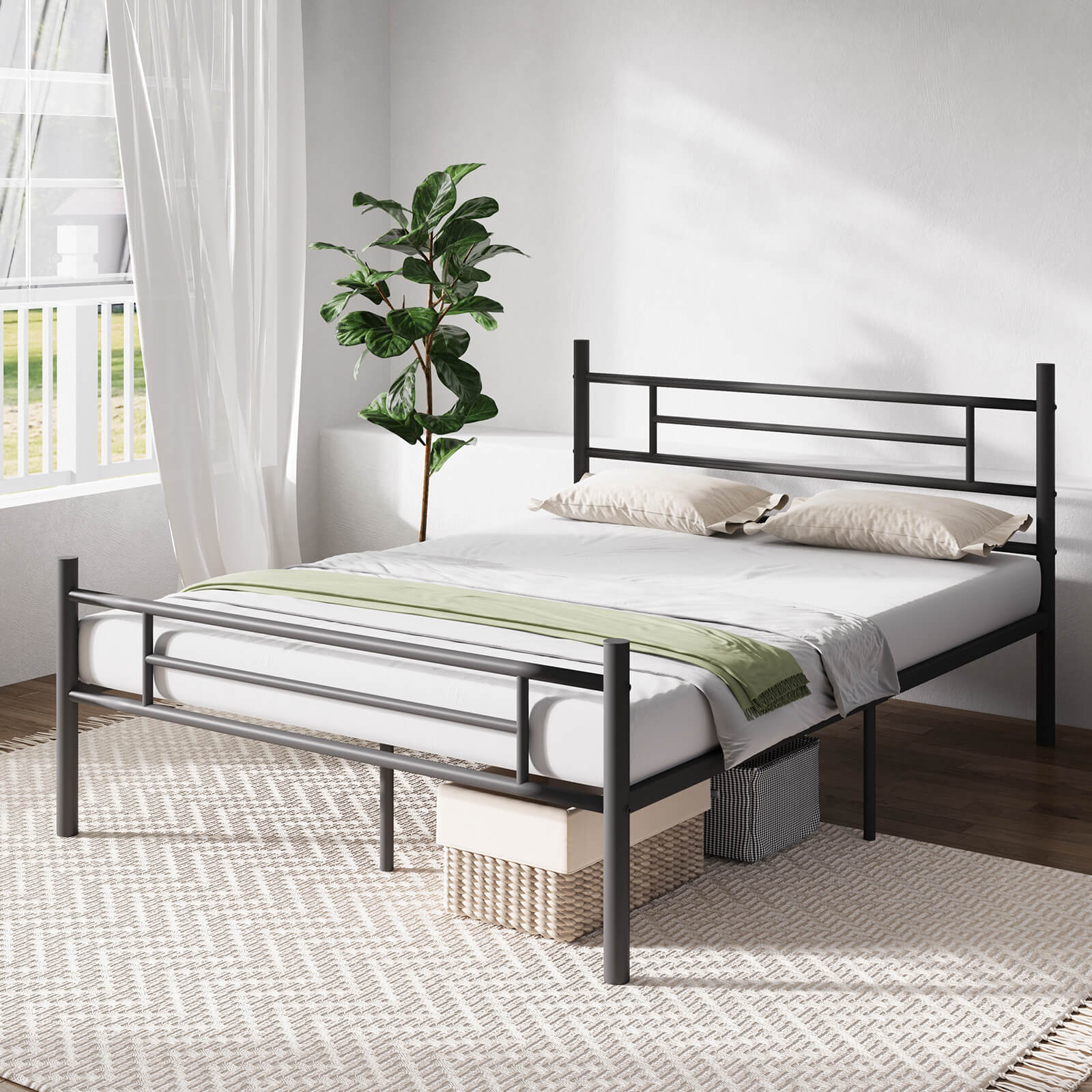 Dark gray wrought metal sleigh bed frame with geometric headboard, white mattress, beige pillows, and green throw in bedroom.