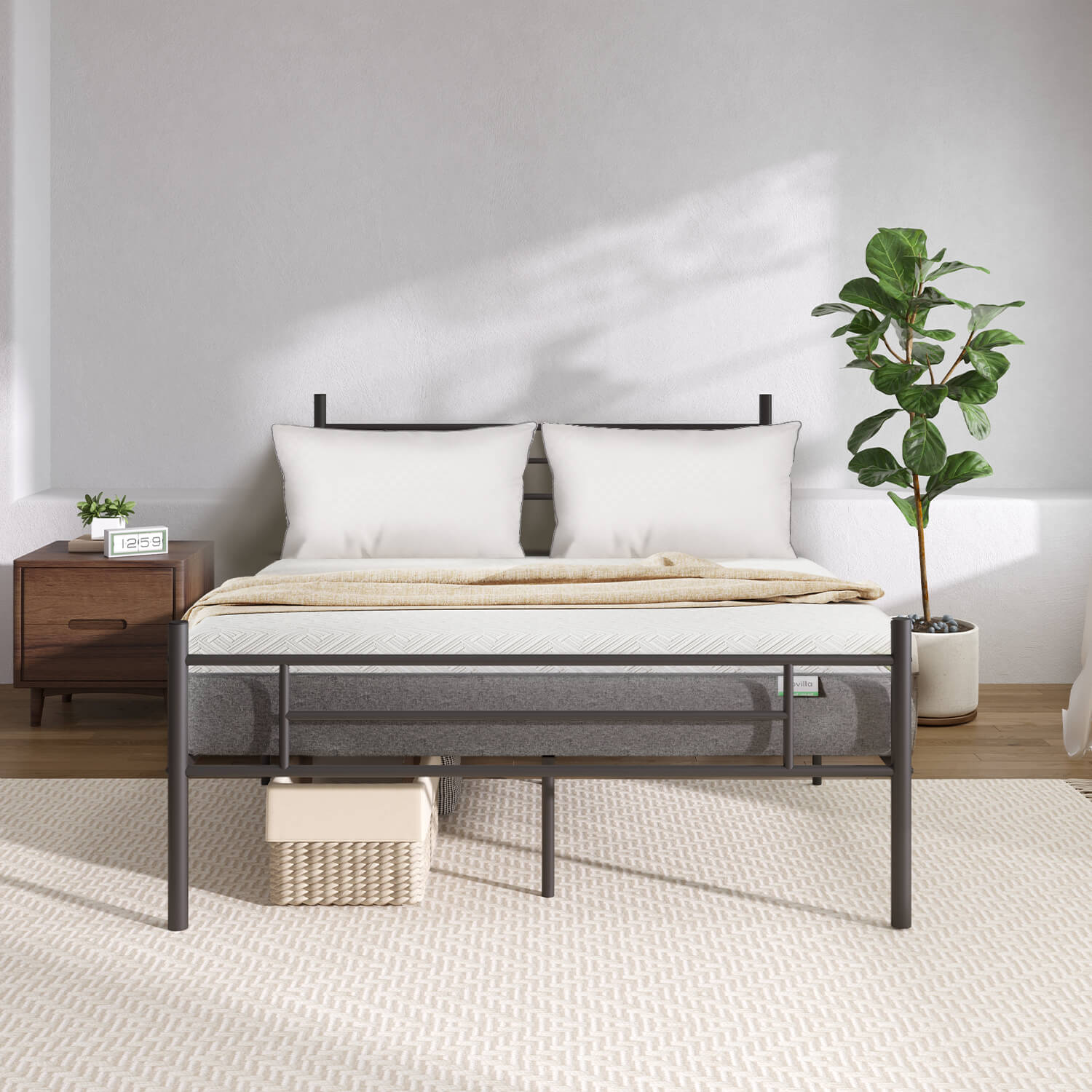 Bliss Silent Support mattress with white pillows and beige throw on black metal bed frame, in a modern bedroom setting.