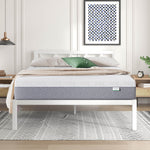 Novilla Bliss Comfort mattress with white quilted top on white bed frame in modern bedroom.