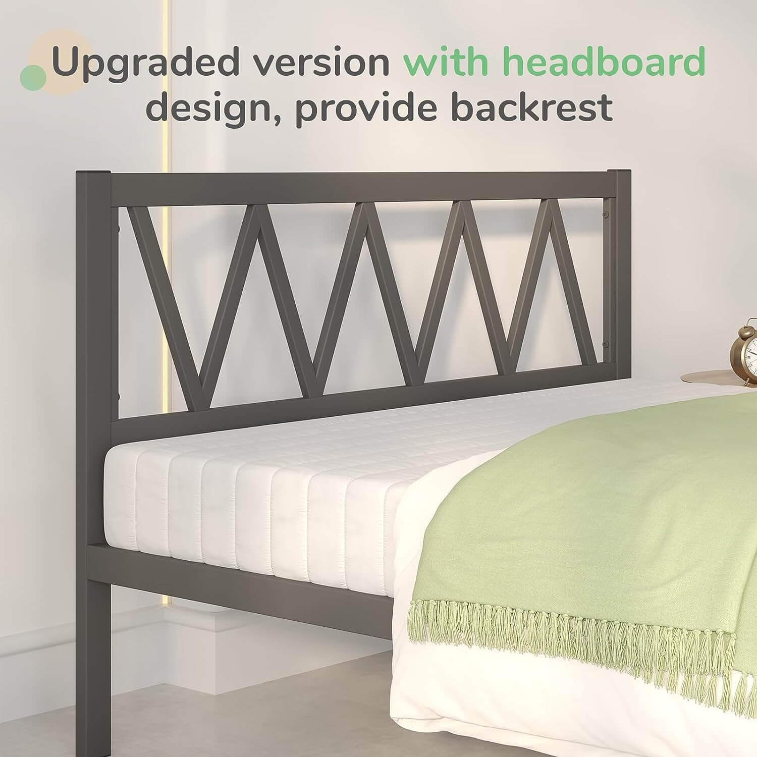 Dark gray metal bed frame with geometric headboard design, white bedding, and green throw blanket on bedroom setting.
