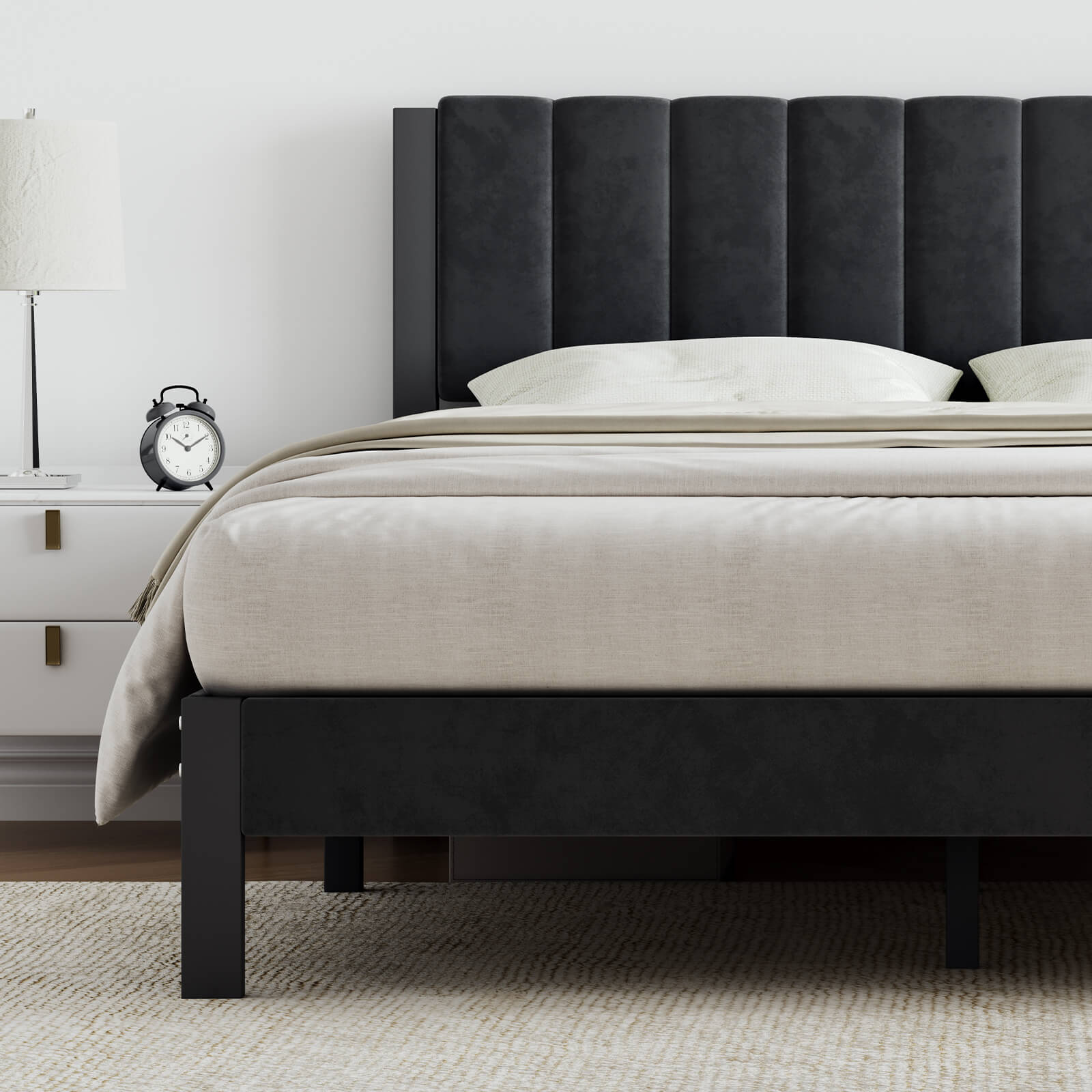 Dark grey velvet platform bed frame featuring a tall channel-tufted headboard on a bedroom setting.